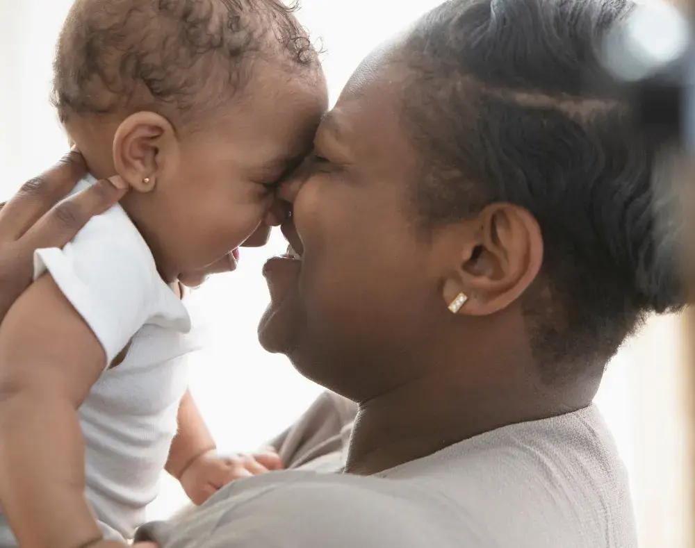 a mum and baby embracing